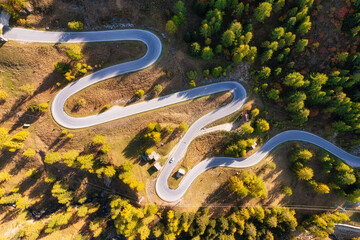 Wall Mural - natural landscape from air. aerial view on the road and forest at the autumn time. an aerial summer 