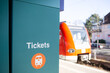 ticket fahrschein ticketschalter fernverkehr zug s-bahn fährt im hintergrund. 9 euro transport
