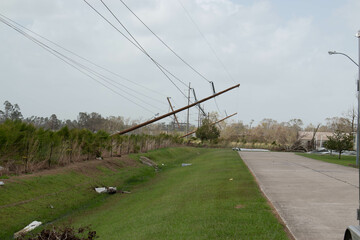 Telephone poles and power lines down after a hurricane. 