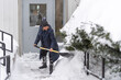 © TOimages - Woman Shovelling Snow