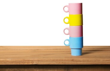 Sticker - Colorful coffee and tea cups on wooden table