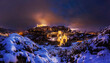 © Cavan Images - Lights of Toledo on after a winter snowstorm.