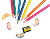 Fototapeta  - Set of colored pencils of different colors and a sharpener with shavings
