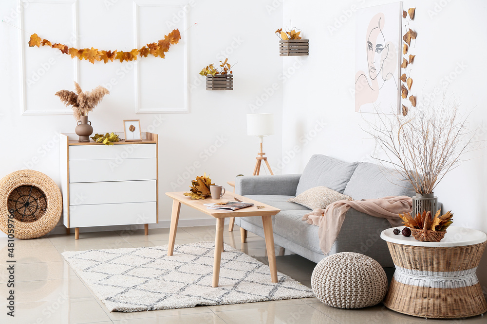 Interior of modern living room with autumn decor