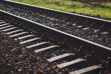 Railway Track Closeup, Rails, Fasteners, Railroad Ties Of Train Tracks On Railroad