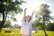 © zinkevych - Young girl enjoying a sunny morning in the park