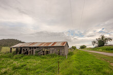Australian Country Road With Abandoned Cow Shed