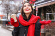 © Pixel-Shot - Happy woman with paper cup looking up on winter day