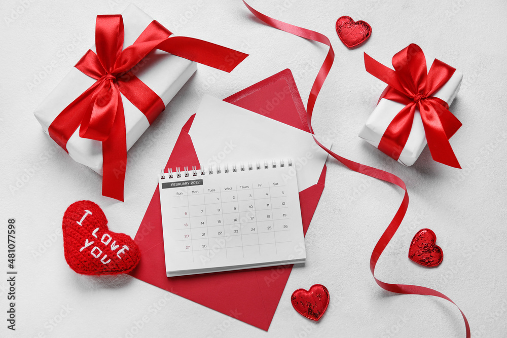 Calendar with envelope, ribbon, gifts and hearts on white background. Valentine's Day celebration