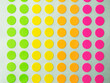 © killykoon - Sheet of circle labels or dot sticker in various neon colors. .also called coding Dot Labels. Close-up macro from above.