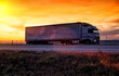 A beautiful truck with a trailer against the backdrop of an evening sunset before night. The concept of work and rest regime for truck drivers. Fine for breaching rules