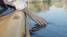 Close Up Back Young Adult Woman Hand On Kayaking Canoe Boat On A Lake Touching A Clear Transparent Water On Summer Day, Adventure Travel Leisure Enjoying Concept, Lifestyle Sport Vacation