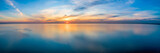 Fototapeta Na ścianę - Wide aerial panorama of seascape - sunset reflecting in calm sea