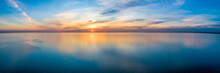 Wide Aerial Panorama Of Seascape - Sunset Reflecting In Calm Sea