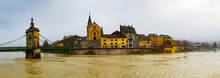 Panoramic View Of Seyssel Embankment On Rhone River With Ancient Saint-Blaise Church And Suspension Bridge On Winter Day, Haute-Savoie Department, France
