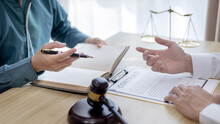Attorney Or Judge Provides Legal Advice To The Client In The Courtroom, Ethics In The Courts Include Justice And Impartiality, Legal Consultant, Scales Of Justice, Law Hammer, Litigation And Justice.
