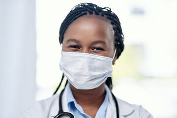 Aufkleber - Serving on the frontlines. Portrait of a young doctor wearing a face mask while working in a hospital.