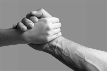 Canvas Print - Friendly handshake, friends greeting, teamwork, friendship. Challenge strength comparison