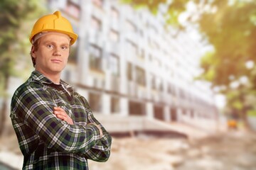 Wall Mural - Male engineer handsome man or architect looking construction with safety helmet