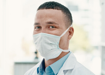 Poster - Safety comes first in our lab. Portrait of a confident young scientist wearing a mask in a modern laboratory.