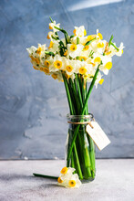 Bunch Of Narcissus Flowers In A Vase With A Thank You Tag