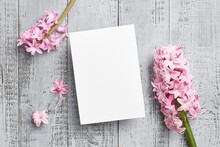 Greeting Or Invitation Card Mockup With Pink Hyacinth Flowers On Wooden Background