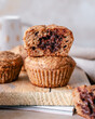 © RooM The Agency - Close-Up of muffins filled with melted chocolate on a wooden chopping board