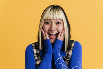 Wall Mural - Asian girl with piercing laughing and looking at camera