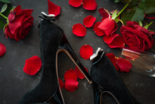 Romantic Valentines Day Rendezvous With Red Roses And Black Stilettos. Background For Love And Special Moments. Top View.