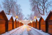 Solomiya Krushelnytska Lviv State Academic Theatre Of Opera And Ballet In Winter Time. Wooden Christmas Fair Kiosk In A Row With City Light In Morning Time