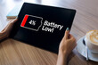 Battery low message on mobile device screen. Internet and technology concept.