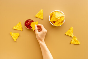 Mexican tortilla corn chips nachos with salsa sauce in bowl