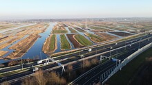 Highway Photographed From The Air With A Drone. Along The Dutch City Of Zaandam In The Netherlands With A Polder Landscape In The Background. Choose Destination And Arrive At Your Goal.