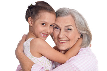 Sticker - Portrait of grandmother hugging with her cute granddaughter