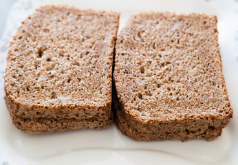 wheat bread slices close up on white background