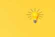 Concept creative idea with lightbulb on yellow background