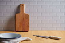Wooden Cutting Board On Table In Domestic Kitchen