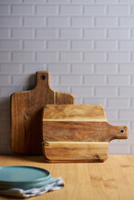 Wooden Cutting Boards On Table In Domestic Kitchen