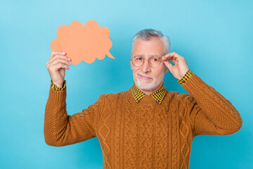 Sticker - Photo of unsure man hold paper card speech bubble speak talk isolated blue color background