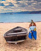 Boat On The Beach And Doll Near
