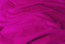 Texture Pink Fabric Top View. Pink Fuchsia Soft Pleated Fabric