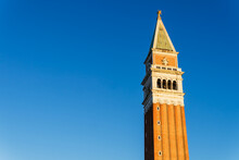 Facade Of St Marks Campanile With Spire Against Clear Blue Sky