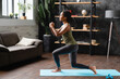 © InsideCreativeHouse - Sport training fitness at home. African female young athlete doing physical exercises on mat, slimming, leading healthy lifestyle