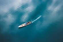 Motorboat Floating In Blue Lake