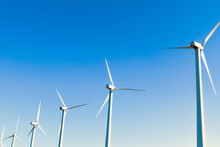 Wind Turbines Farm Hillside Row Renewable Energy Clear Blue Sky