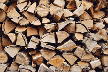 Stacked Chopped Dried Logs Texture As Background
