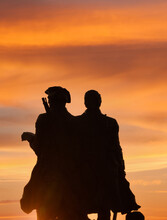 Sunset And A Sillouette Of Lewis And Clark On The Oregon Coast At Seaside, At The Turnaround. Historically The Turnaround Is Where Lewis & Clark Ended Their Journey.