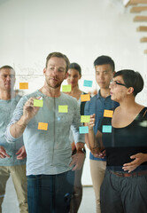 Poster - planning is the first step. cropped shot of a group of young designers planning on a glass board.