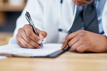 Aufkleber - Updating his notes. Closeup shot of an unrecognisable doctor writing notes on a clipboard in an office.