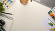 © bongkarn - Creative artist students worktable with copy space on white background.